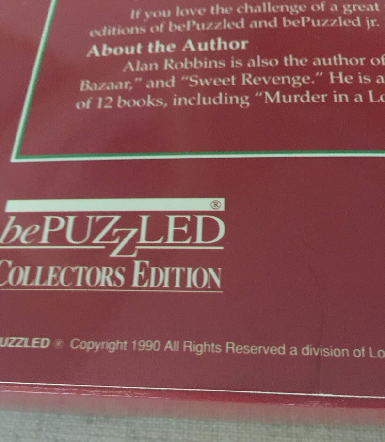 K&ouml;nnte beinhalten: Eine rote Box mit dem Text "bePUZZLED COLLECTORS EDITION" und den Copyright-Informationen "Copyright 1990 All Rights Reserved a division of Lo".