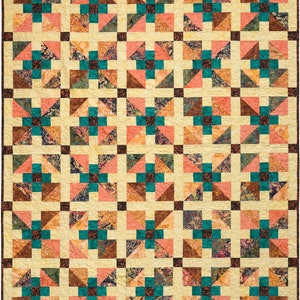 May include: A quilt with a repeating pattern of teal, brown, and pink squares. The squares are arranged in a grid pattern, and each square is made up of smaller triangles.