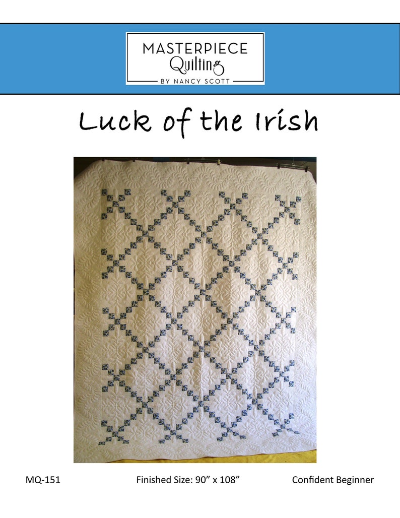 May include: A white quilt with a blue and white diamond pattern. The quilt is called "Luck of the Irish" and is 90 inches by 108 inches. It is a confident beginner quilting pattern.
