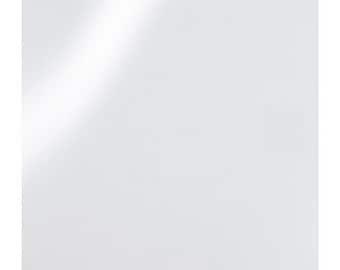 May include: A plain white background with a subtle light source casting a shadow.