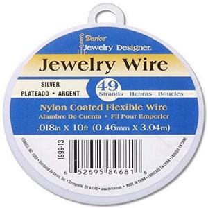 May include: A white spool of silver-plated nylon coated flexible jewelry wire. The spool is labeled "Jewelry Wire" and features the text "49 Strands Hebras Boucles" and "0.018in x 10ft (0.46mm x 3.04m)".
