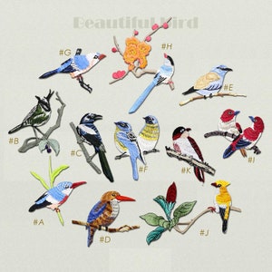 May include: Set of 11 embroidered iron-on patches featuring various colorful birds perched on branches. The patches are labeled with numbers A through J and G through I.
