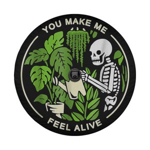 May include: A black and white illustration of a skeleton watering plants with the text "You make me feel alive".