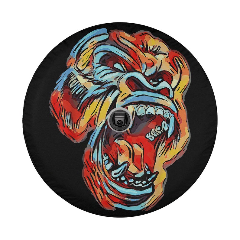 May include: A colorful illustration of a gorilla's face with its mouth open, revealing sharp teeth. The gorilla's face is painted in shades of red, orange, yellow, blue, and black against a black background.