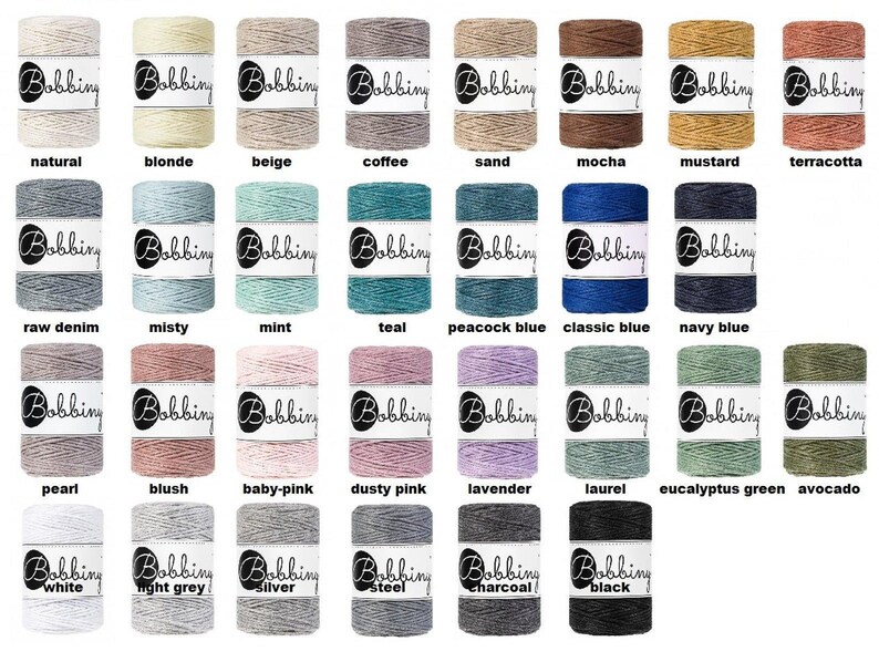 May include: A collection of 24 spools of cotton cord in various colors, including natural, blonde, beige, coffee, sand, mocha, mustard, terracotta, raw denim, misty, mint, teal, peacock blue, classic blue, navy blue, pearl, blush, baby-pink, dusty pink, lavender, laurel, eucalyptus green, avocado, white, light grey, silver, and steel. Each spool has a white label with the word "Bobbing" printed on it.