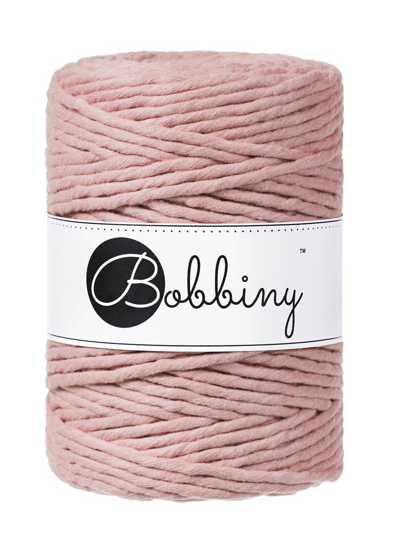 May include: A roll of dusty rose colored cotton rope with a white label that says "Bobbiny&trade;".