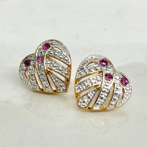 May include: A set of three ceramic mugs with a speckled, matte finish in cream, light grey, and dark grey. Each mug has a simple, minimalist design, suitable for coffee or tea.