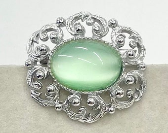 Vintage Silver Tone Mint Green Czech Glass Brooch with a Scrolled Filigree Surround