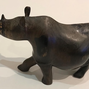 Vintage hand carved hard wood black African rhino. 15cm-6” long.