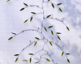 Mobile willow branch with poetic quote from Lao She
