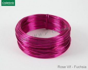 May include: A roll of fuchsia colored aluminum wire. The wire is used for floral arrangements and crafts.