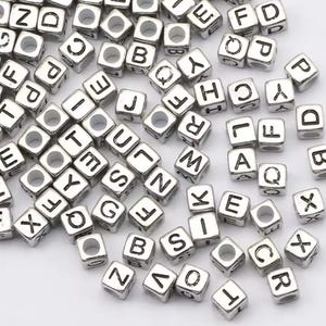 X10 piezas de cuentas con letras del alfabeto en forma de cubo.