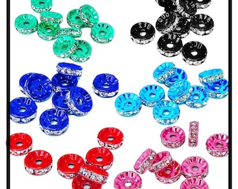 May include: Assortment of colorful round beads with rhinestones. The beads are in six colors: black, teal, blue, red, pink, and green.