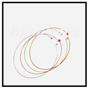 May include: Three hoop earrings in different metal finishes: silver, gold, and rose gold. The hoops are all the same size and are arranged in a stack.