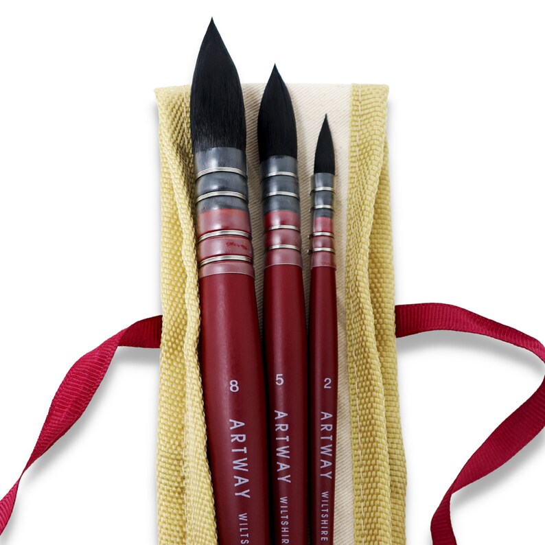 May include: Three red handled paint brushes with black bristles in a beige canvas pouch. The brushes are labeled "Artway Wiltshire" and have the sizes "8", "5", and "2" printed on them.