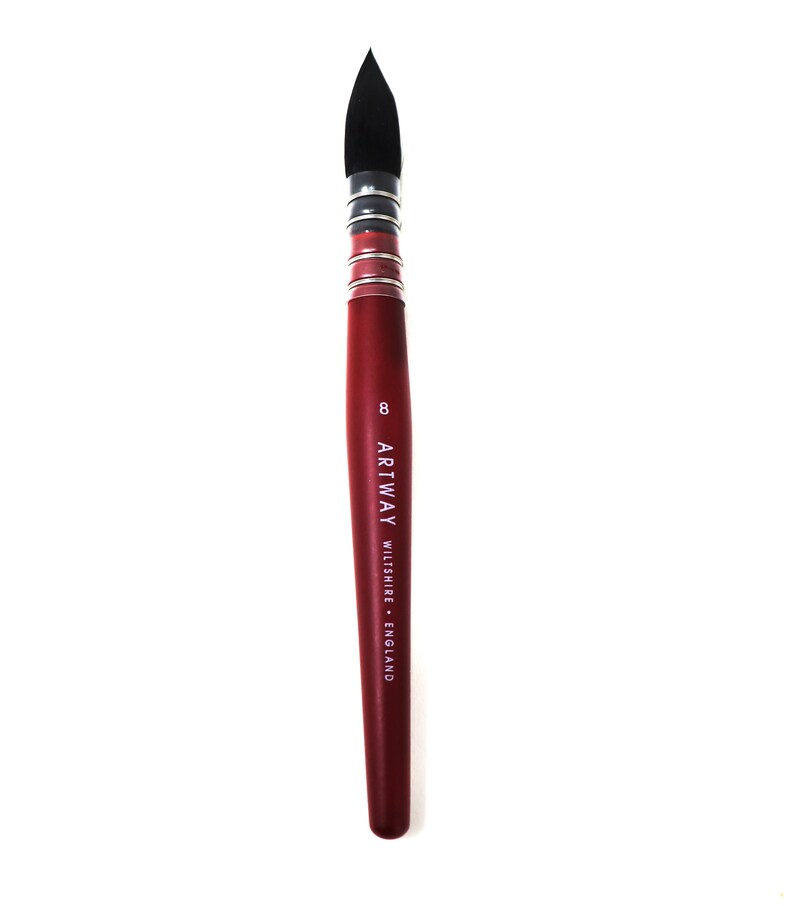 May include: A red handled paint brush with black bristles. The brush is labeled "ARTWAY WILTSHIRE ENGLAND" and "8".