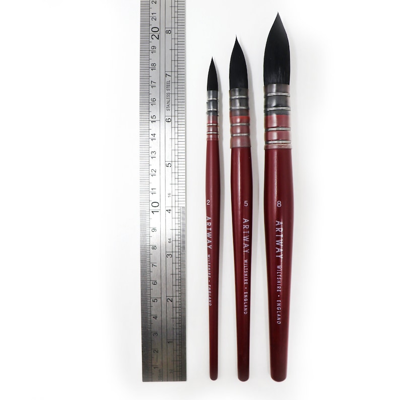 May include: Three paint brushes with red handles and black bristles. The brushes are labeled "ARTWAY WILTSHIRE - ENGLAND" and are sized 2, 5, and 8.