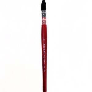 May include: A red handled paint brush with black bristles and a silver ferrule. The brush is labeled "ARTWAY WILTSHIRE - ENGLAND" and "5".