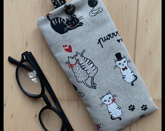 “White Cats, Black Cats” glasses case in bachette fabric.