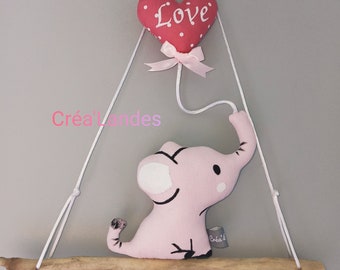 Hanging baby elephant and his balloon baby room wall decoration