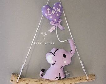 Driftwood decoration for baby room with purple elephant and balloon pattern