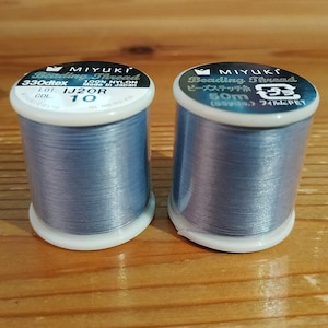 A spool of Miyuki nylon thread Bleu