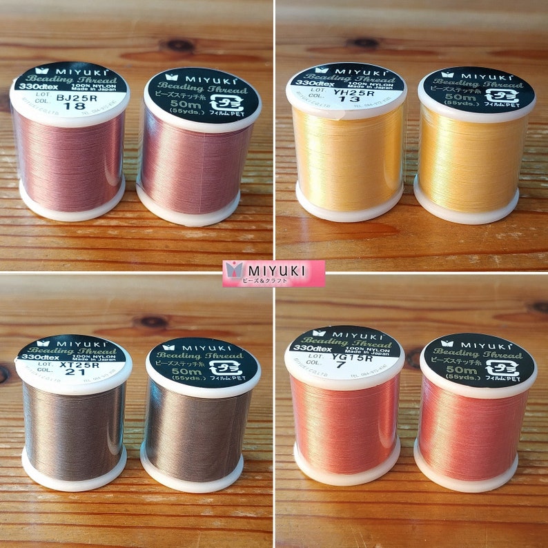 May include: Six spools of beading thread in various colors, including gold, pink, brown, and gray. Each spool is labeled with the brand name "MIYUKI" and the text "Beading Thread".