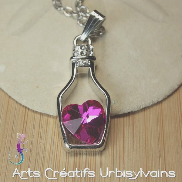 Chaîne et pendentif bouteille en métal argenté et cœur en cristal rose
