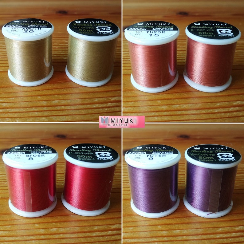 May include: Eight spools of Miyuki Beading Thread in various colors, including gold, copper, red, and purple. Each spool is labeled with the brand name, thread type, and length in meters. The spools are arranged in two rows of four.