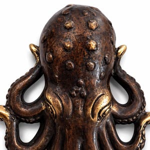 Detailed brass octopus sculpture wall hook nautical ocean inspired decor