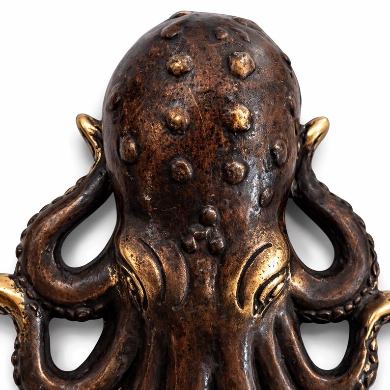 Detailed brass octopus sculpture wall hook nautical ocean inspired decor