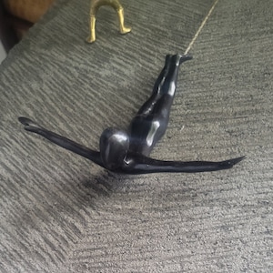 Brass wall sculpture.#1 variation Flying, athlete figurine