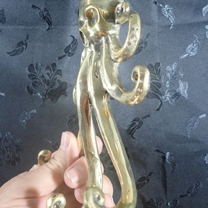 Brass octopus wall hook held in hand, kraken coat hook gothic nautical brass decor