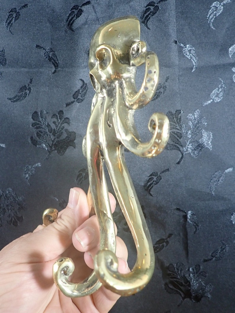 Brass octopus wall hook held in hand, kraken coat hook gothic nautical brass decor