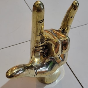 Heavy metal symbol decorative brass hand