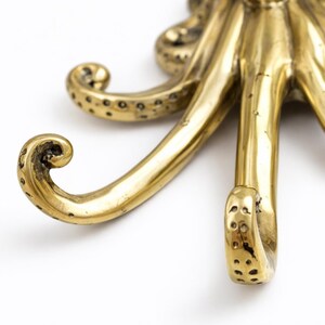 Brass octopus tentacle hook detail, decorative kraken wall hook nautical brass craftsmanship