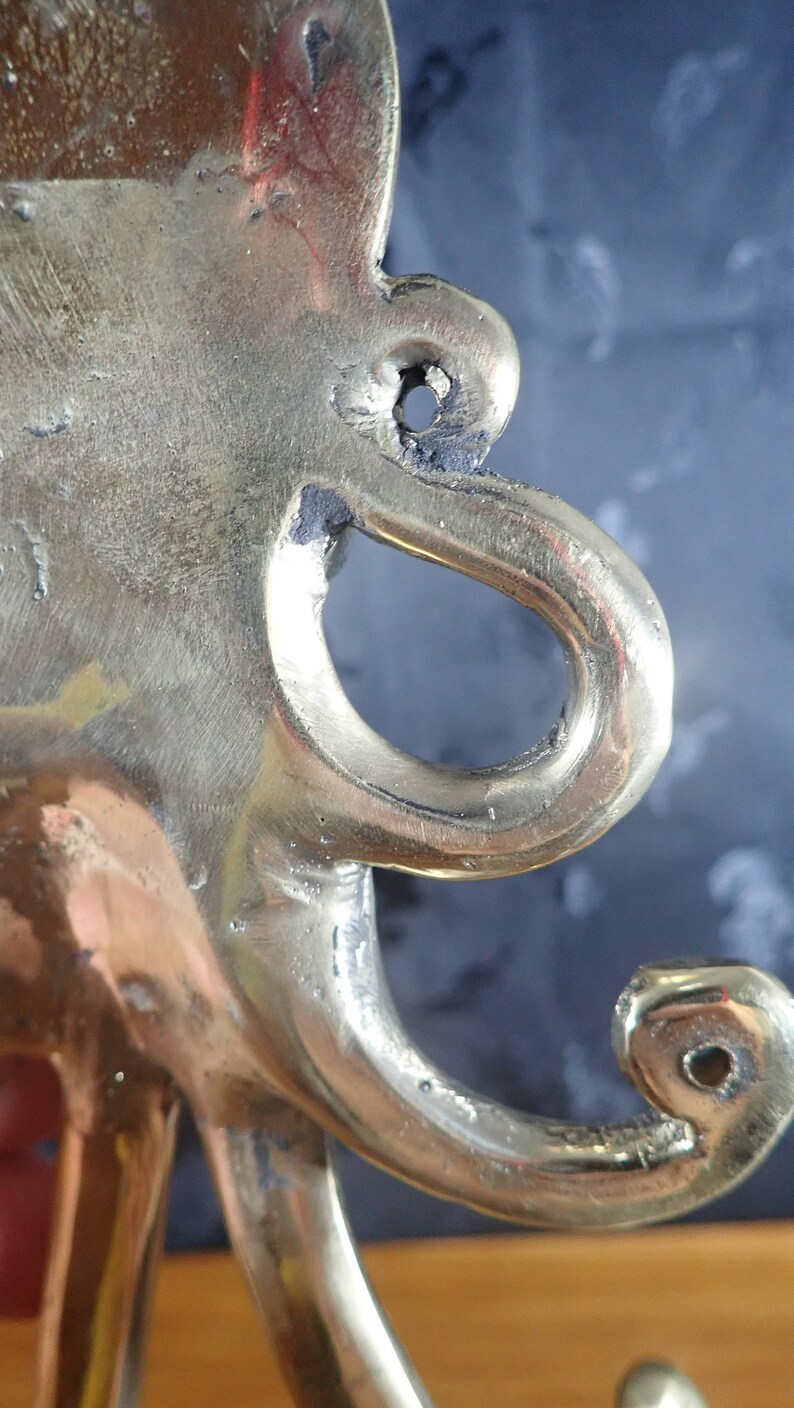 Curved brass octopus tentacle hook detail, kraken wall hook nautical brass craftsmanship
