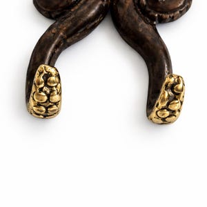 Close-up detail of octopus hook tentacles used for hanging coats towels or keys