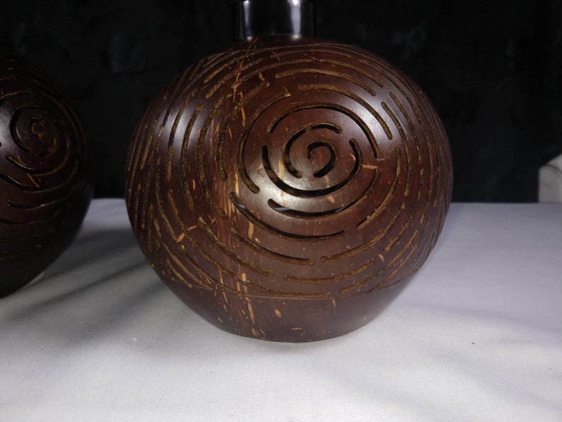 Carved coconut shell lamp pattern detail, handmade coconut lighting design Bali