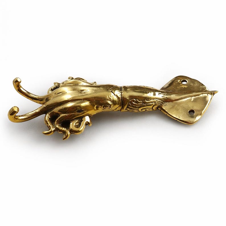 Brass squid wall hook side view showing tentacle details ocean inspired wall hanger