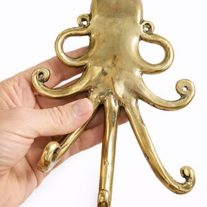 Back view brass octopus wall hook installation view, kraken hook mounting hardware