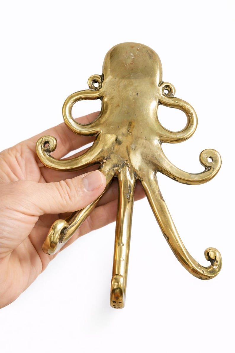 Back view brass octopus wall hook installation view, kraken hook mounting hardware