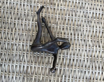 Brass Climbing Variation, Man Feet up Arms Out Large