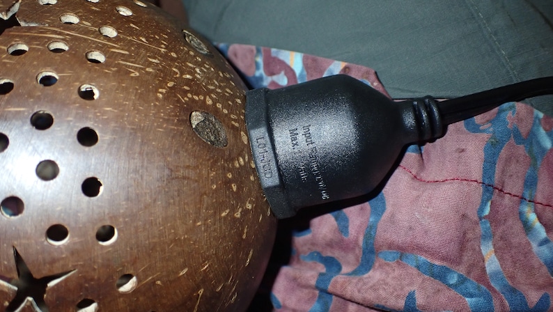 Coconut shell lamp cord connection detail, tropical handmade lighting component