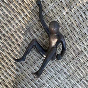 Brass climbing sculpture.#13 variation, man rope behind large solid bronze metal wall sculptures decor. Athlete figurine,