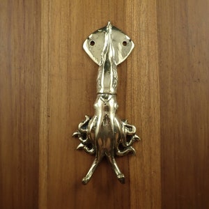 Squid wall hook installed on wooden wall nautical coastal decor towel hanger