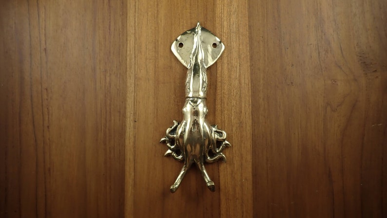 Squid wall hook installed on wooden wall nautical coastal decor towel hanger