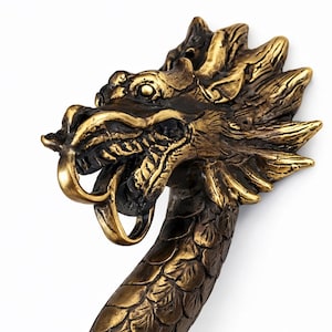 Close up dragon head detail solid brass dragon door handle sculpture