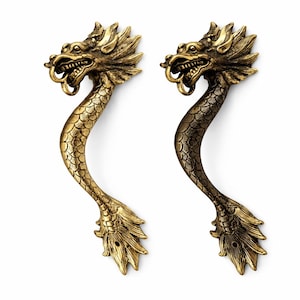 Dragon door handle mounted on wooden front door vintage brass dragon door pull