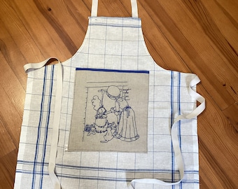 Blue kitchen apron “At the stove”